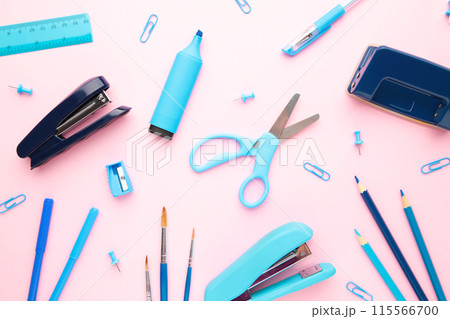 Blue school supplies on pink background. Back to school. Flat lay. Blue school supplies on pink background. Back to school. Flat lay. 115566700