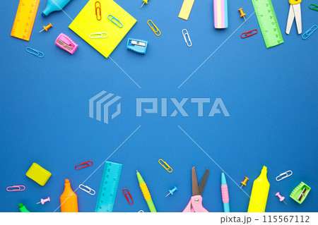 Back to school concept on blue background. Top view 115567112