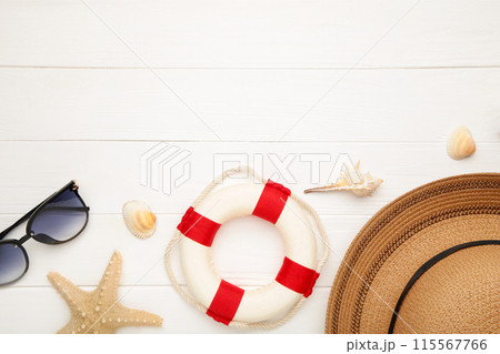 Beach accessories on white wooden background. Top view 115567766
