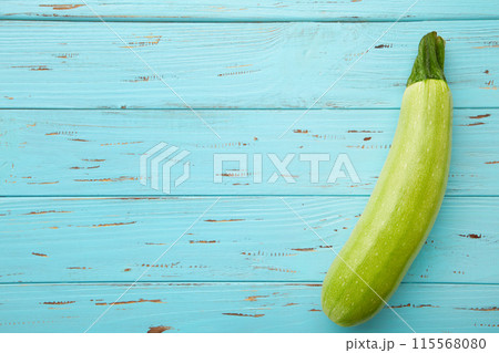 Squash vegetable marrow zucchini on blue background with copy space 115568080
