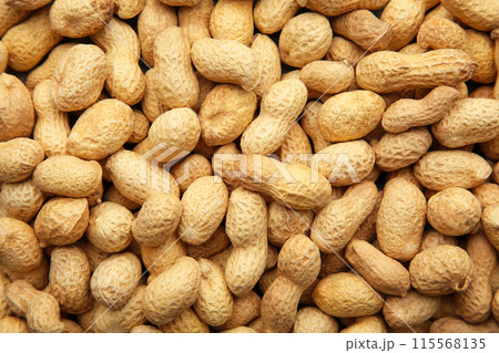 Many peanuts in shells background. Food texture Many peanuts in shells background. Food texture 115568135