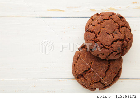Chocolate chips cookies on white background with copy space Chocolate chips cookies on white background with copy space 115568172