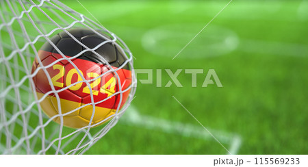 Football or soccer ball with flags of Germany in the net of goal of football stadium. German or european championship of soccer. 115569233