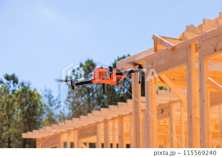 An inspection of construction site work using drone is conducted by supervisor for contractor An inspection of construction site work using drone is conducted by supervisor for contractor 115569240