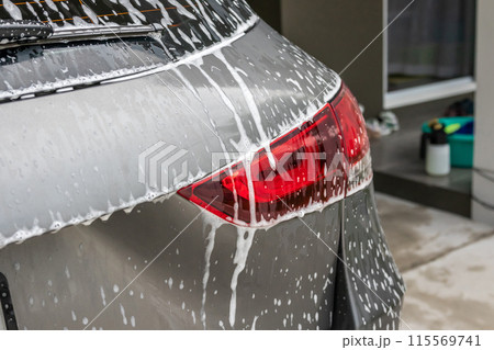 car cleaning and washing with foam soap 115569741