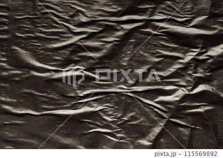 Black crumpled and creased paper poster grunge texture background 115569892