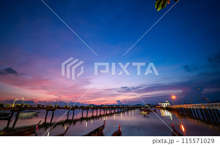 amazing cloud moving in colorful sunrise above Chalong pier. 115571029