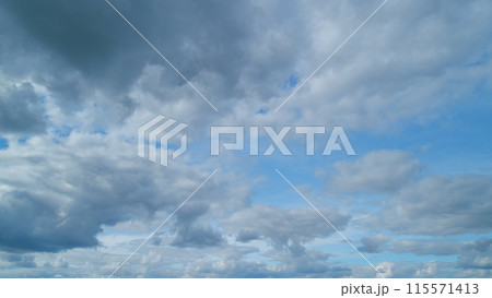 Fluffy clouds sky atmosphere. Puffy fluffy white clouds. Cloud sky scape. Timelapse. Fluffy clouds sky atmosphere. Puffy fluffy white clouds. Cloud sky scape. Timelapse. 115571413