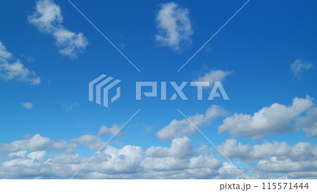 Forming clouds in summer day outdoors. Clouds nature background. Timelapse. Forming clouds in summer day outdoors. Clouds nature background. Timelapse. 115571444