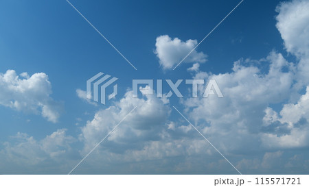 Dramatic majestic amazing blue sky. Puffy fluffy white clouds. Timelapse. Dramatic majestic amazing blue sky. Puffy fluffy white clouds. Timelapse. 115571721