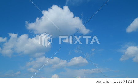 White cumulus and cirrus on different layers cloudscape on beautiful sunny clear sky. Tropical summer sunlight. Timelapse. White cumulus and cirrus on different layers cloudscape on beautiful sunny clear sky. Tropical summer sunlight. Timelapse. 115571811