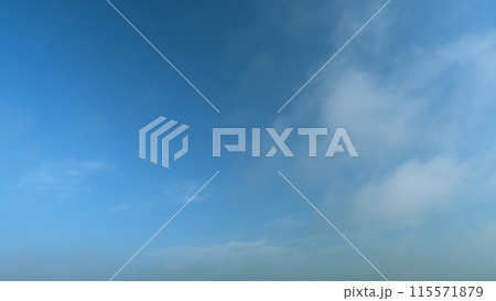 Fluffy layered clouds sky atmosphere. Puffy fluffy white clouds. Formation cloud sky scape. Timelapse. 115571879