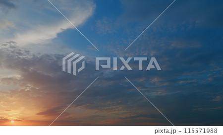Sunset sun is setting with beautiful clouds in orange sky. Cloudscape nature background. Timelapse. Sunset sun is setting with beautiful clouds in orange sky. Cloudscape nature background. Timelapse. 115571988