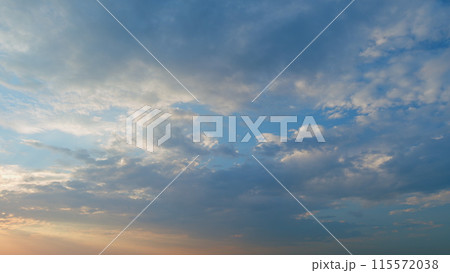 Sunset or dawn backlit by warm sun. Panorama style background. Sunset or dawn sky. Timelapse. Sunset or dawn backlit by warm sun. Panorama style background. Sunset or dawn sky. Timelapse. 115572038