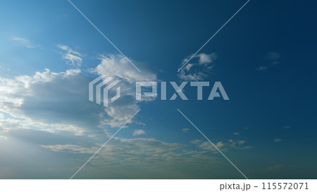 Building clouds and sun rays breaking through cloud mass. Flares shinning through dramatic clouds. Timelapse. Building clouds and sun rays breaking through cloud mass. Flares shinning through dramatic clouds. Timelapse. 115572071