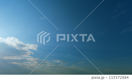 Sunrays sunray shine through dark clouds in cloudy blue sky. Layers of cloud space. Natural background. Timelapse. Sunrays sunray shine through dark clouds in cloudy blue sky. Layers of cloud space. Natural background. Timelapse. 115572084