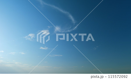 Solar energy concept of bright sun ray. Building clouds and sun rays breaking through cloud mass. Timelapse. 115572092