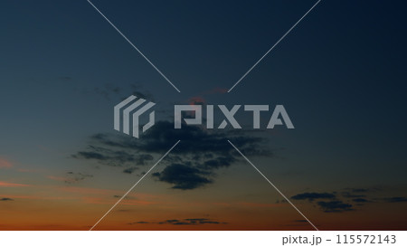 Texture of bright evening sky during sunset. Background of clouds on the burning dawn. Timelapse. 115572143