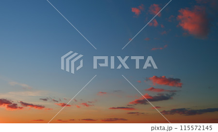 Clouds in different shades. Clouds during sunset. Panoramic view. Timelapse. 115572145