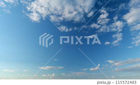 Clear gradient blue sky in tropical summer sunlight. Beautiful sunny clear blue sky in tropical summer with cumulus and cirrocumulus on different layers clouds. Timelapse. 115572483