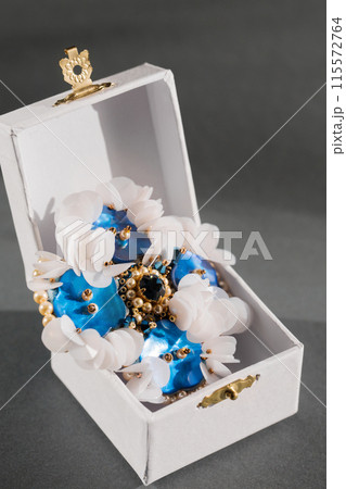 Handmade brooch with mother-of-pearl buttons and white sequins in a small box 115572764