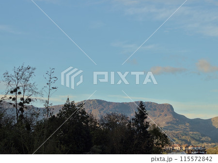 beautiful winter day in the mountains with blue sky 115572842