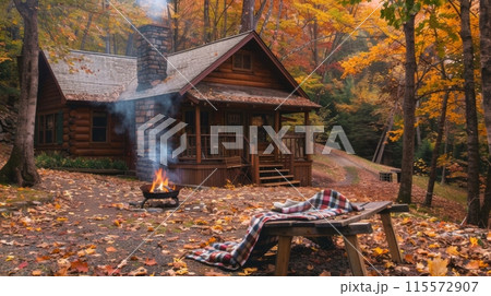 A cozy log cabin nestled in the woods, with an inviting fire pit and blanket on a bench A cozy log cabin nestled in the woods, with an inviting fire pit and blanket on a bench 115572907