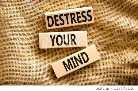 Destress your mind symbol. Concept words Destress your mind on wooden blocks. Beautiful canvas table canvas background. Psychological business and destress your mind concept. Copy space. Destress your mind symbol. Concept words Destress your mind on wooden blocks. Beautiful canvas table canvas background. Psychological business and destress your mind concept. Copy space. 115573116