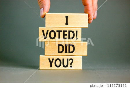 I voted. Did you symbol. Concept words I voted. Did you on beautiful wooden block. Beautiful grey table grey background. Voter hand. Business I voted. Did you concept. Copy space. 115573151