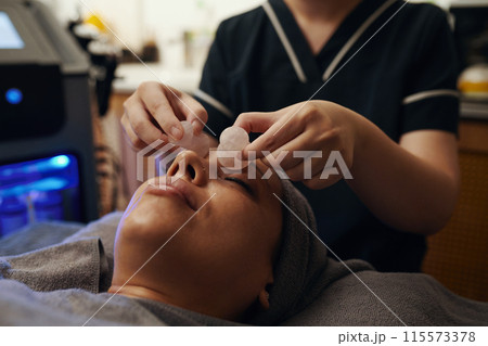 Massaging Face with Quartz Stones Massaging Face with Quartz Stones 115573378