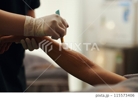 Beautician Applying Gel on Body Beautician Applying Gel on Body 115573406