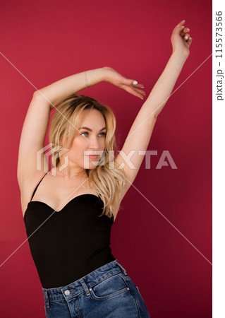 Portrait of a dancing blonde young woman 115573566