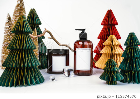 dark jar with lid and dispenser on the background of Christmas decorations, side view 115574370