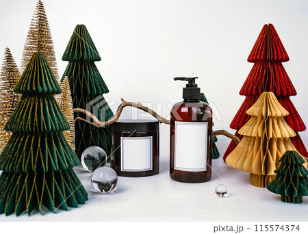 dark jar with lid and dispenser on the background of Christmas decorations, side view dark jar with lid and dispenser on the background of Christmas decorations, side view 115574374
