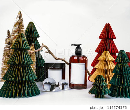 dark jar with lid and dispenser on the background of Christmas decorations, side view 115574376