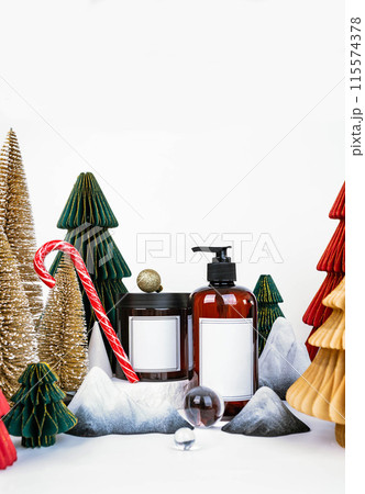 dark jar with lid and dispenser on the background of Christmas decorations, side view 115574378