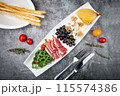 assorted fruits, grape nuts, bacon and arugula, top view 115574386