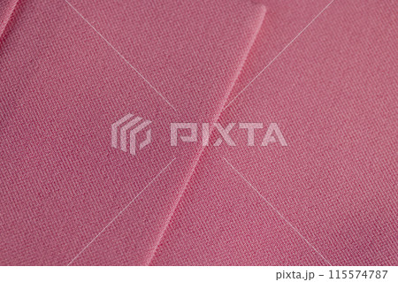 a piece of clothing made of pink fabric 115574787
