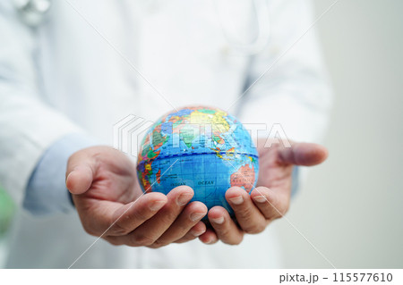 Asian man doctor holding globe, Elements of this image furnished by NASA. Asian man doctor holding globe, Elements of this image furnished by NASA. 115577610