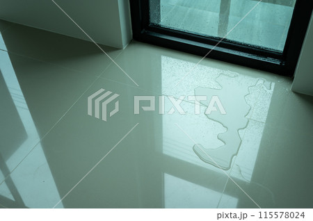 Water leaking on tile floor. Water leaks are often because of pinholes in your plumbing system or small failures in caulking or other exterior materials. Water leaking on tile floor. Water leaks are often because of pinholes in your plumbing system or small failures in caulking or other exterior materials. 115578024