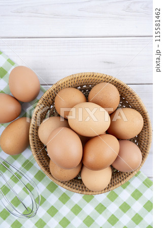 The Organic chicken eggs and egg whisk Organic chicken eggs food ingredients concept. The Organic chicken eggs and egg whisk Organic chicken eggs food ingredients concept. 115581462
