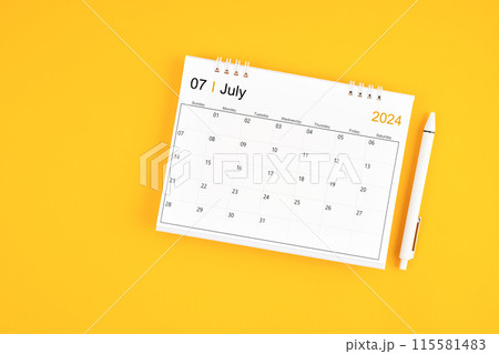 July 2024, Monthly desk calendar for 2024 year and pen on yellow background. 115581483