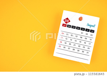 August 2024 calendar page with push pin on yellow background. August 2024 calendar page with push pin on yellow background. 115581643