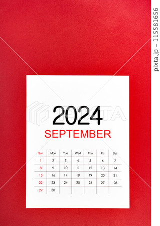 September 2024 calendar page with push pin on red background. September 2024 calendar page with push pin on red background. 115581656