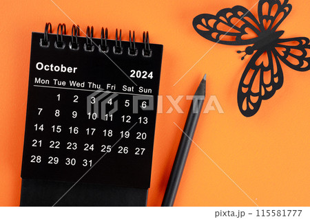 October 2024 desk calendar for the organizer to plan and reminder and butterfly paper on orange. October 2024 desk calendar for the organizer to plan and reminder and butterfly paper on orange. 115581777
