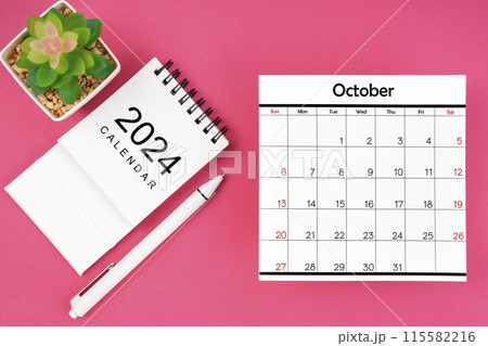 White calendar for October 2024 and pen on pink color background. 115582216