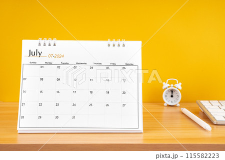 July 2024, Monthly desk calendar for 2024 year on wooden table. 115582223