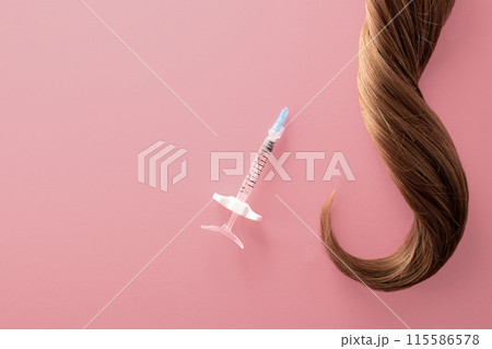 Hair treatment concept. Medical syringe and hair isolated on a white background 115586578