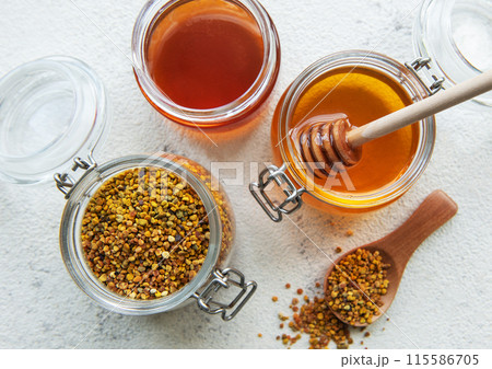 Raw organic bee pollen and honey in jars. Raw organic bee pollen and honey in jars. 115586705