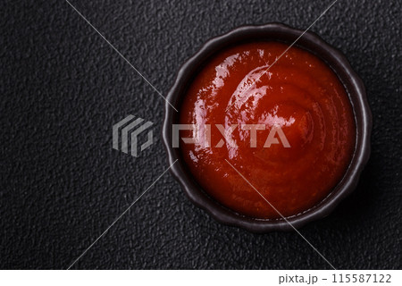 Delicious spicy tomato sauce with pepper, garlic, salt, spices and herbs 115587122